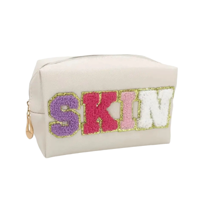 Make-up tas/toilettas SKIN white gekleurde letters